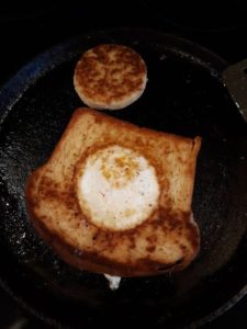 Fried bread and egg in the skillet breakfast recipe