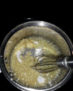 Flour in butter and garlic for gluten and dairy free Alfredo sauce recipe