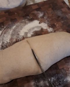French bread dough in half